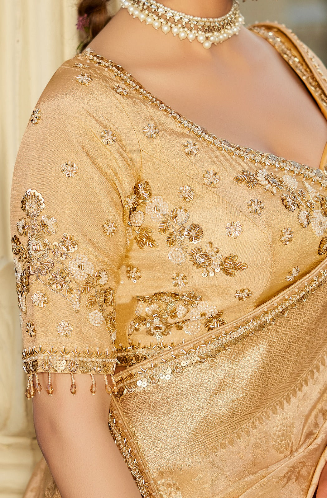Champagne gold viscose silk wedding saree with zari woven motifs and embroidered blouse